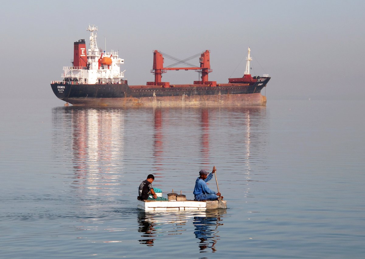Boys on home-made boat, Cienfuegos, Cuba Boys on home-made boat, Cienfuegos, Cuba