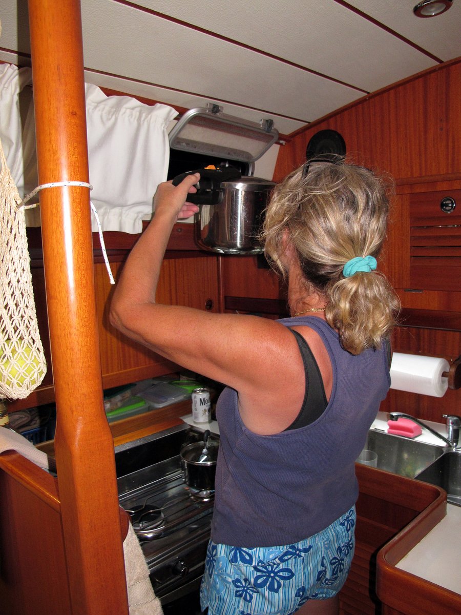 Glenys vents her pressure cooker out of the galley hatch Glenys vents her pressure cooker out of the galley hatch