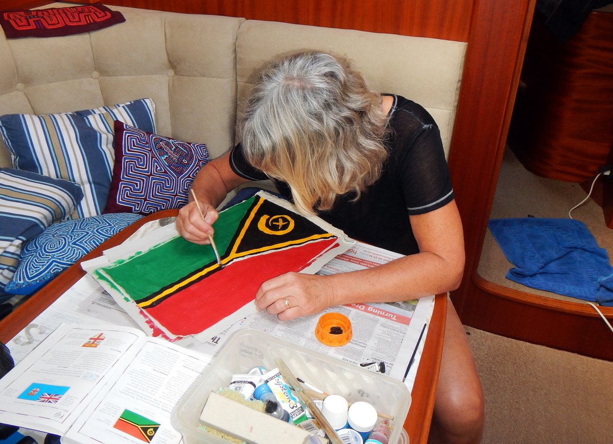 Glenys painting a courtesy flag for Vanuatu Glenys painting a courtesy flag for Vanuatu